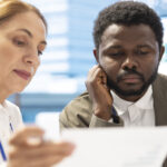 diverse group business associates meets evaluate project updates